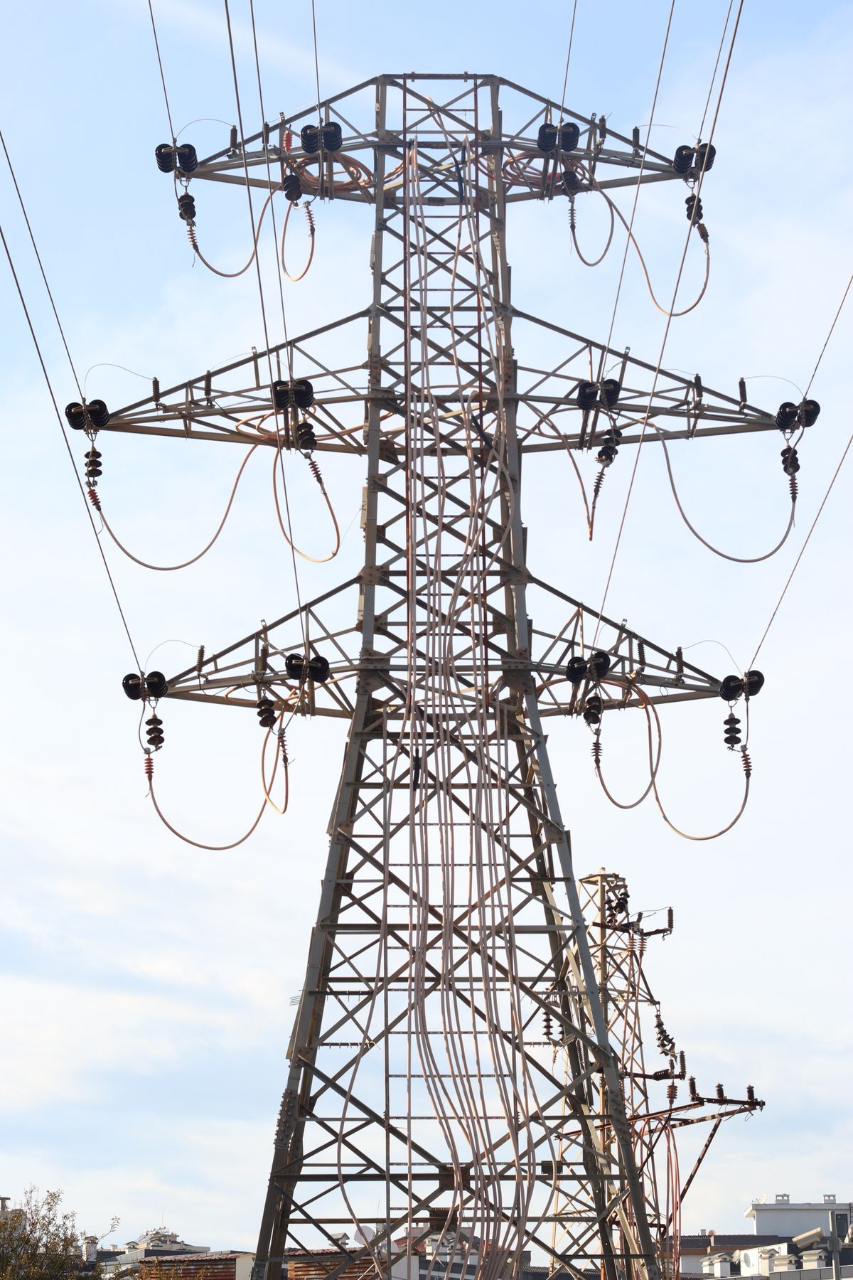 Angle tower with tension insulator strings and jumper loops